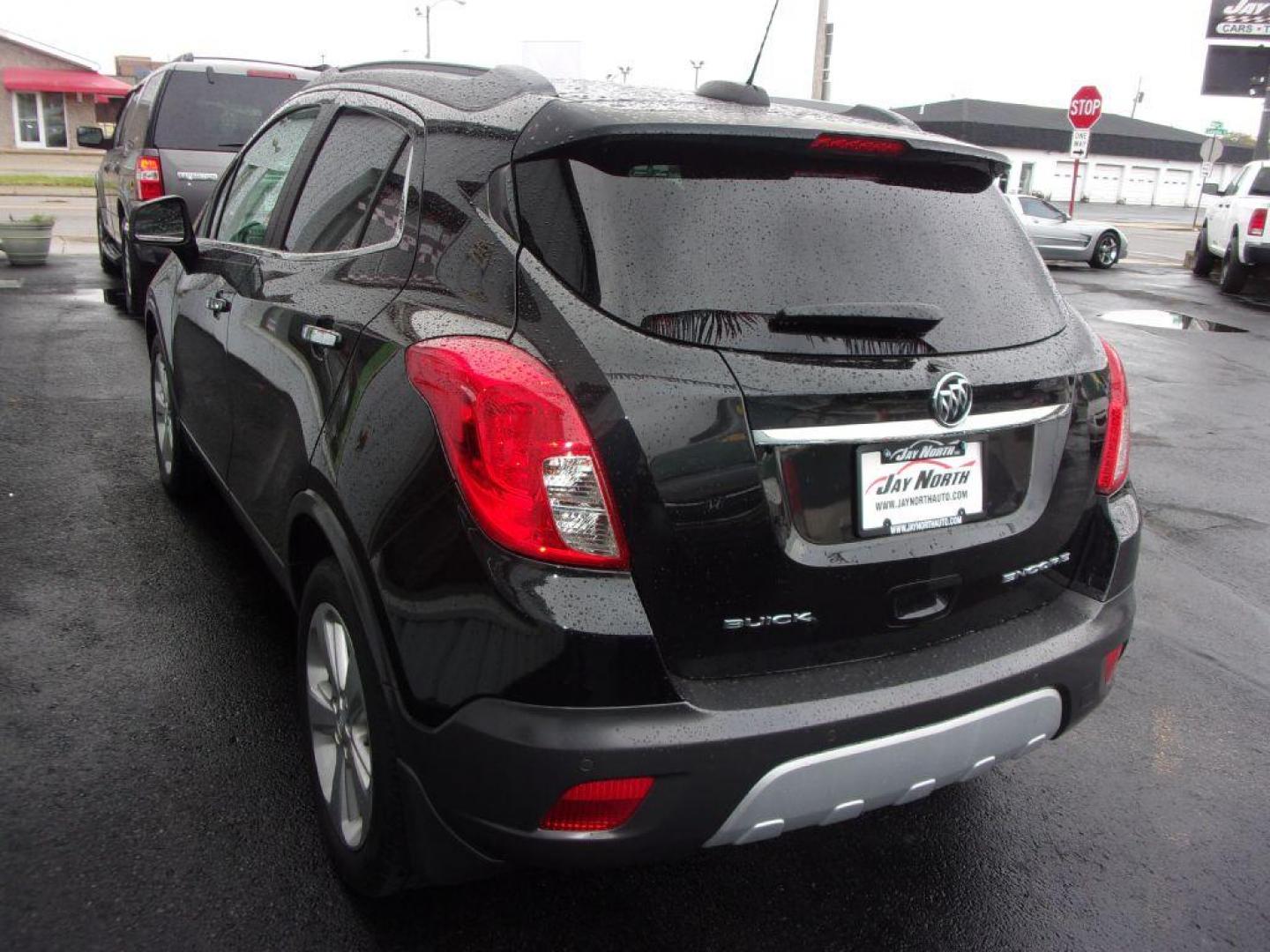 2015 BLACK BUICK ENCORE PREMIUM (KL4CJDSBXFB) with an 1.4L engine, Automatic transmission, located at 501 E. Columbia St., Springfield, OH, 45503, (800) 262-7122, 39.925262, -83.801796 - ***Heated Leather Seating***Heated Steering Wheel***Sunroof***FWD***Serviced and Detailed*** 31 Service Records on CarFax *** Jay North Auto has offered hand picked vehicles since 1965! Our customer's enjoy a NO pressure buying experience with a small town feel. All of our vehicles get fully ins - Photo#5