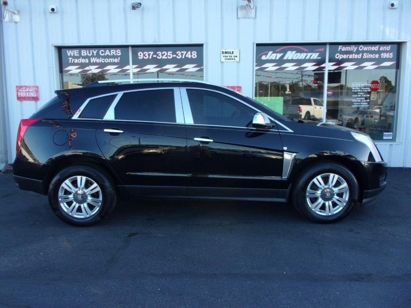 2016 BLACK CADILLAC SRX LUXURY COLLECTION (3GYFNEE32GS) with an 3.6L engine, Automatic transmission, located at 501 E. Columbia St., Springfield, OH, 45503, (800) 262-7122, 39.925262, -83.801796 - *** Luxury Collection *** Panoramic Moonroof *** Bose Audio with Back Up Camera *** Power Lift Gate *** V6 AWD *** Serviced and Detailed *** Remote Start *** Jay North Auto has offered hand picked vehicles since 1965! Our customer's enjoy a NO pressure buying experience with a small town feel. A - Photo#0