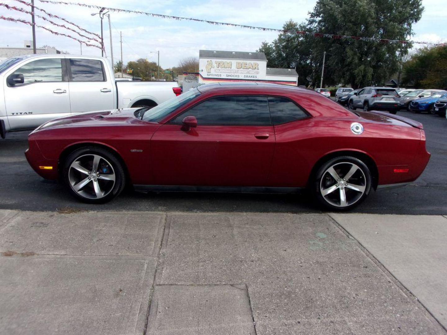 2014 MAROON DODGE CHALLENGER R/T (2C3CDYBT3EH) with an 5.7L engine, Automatic transmission, located at 501 E. Columbia St., Springfield, OH, 45503, (800) 262-7122, 39.925262, -83.801796 - *** R/T *** 5.7L HEMI V8 *** Heated Leather Seating *** Moonroof *** Premium Audio w/ Navigation *** Serviced and Detailed *** NICE!!!! *** Jay North Auto has offered hand picked vehicles since 1965! Our customer's enjoy a NO pressure buying experience with a small town feel. All of our vehicle - Photo#0