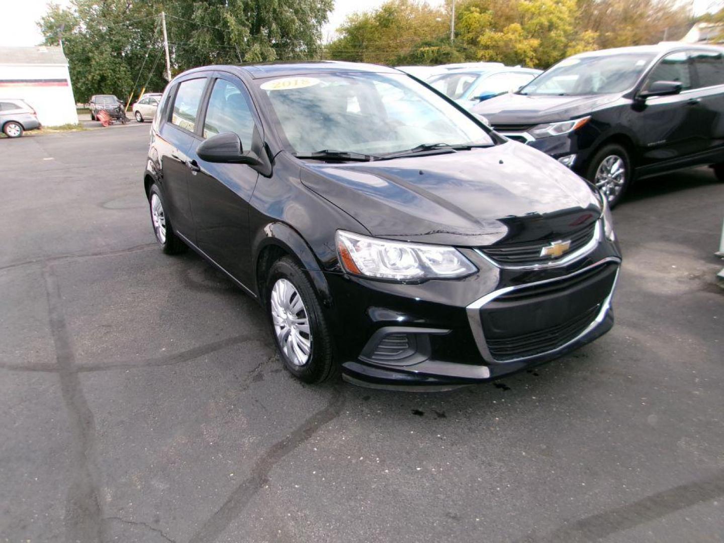 2018 BLACK CHEVROLET SONIC LT (1G1JG6SH4J4) with an 1.8L engine, Automatic transmission, located at 501 E. Columbia St., Springfield, OH, 45503, (800) 262-7122, 39.925262, -83.801796 - Photo#1