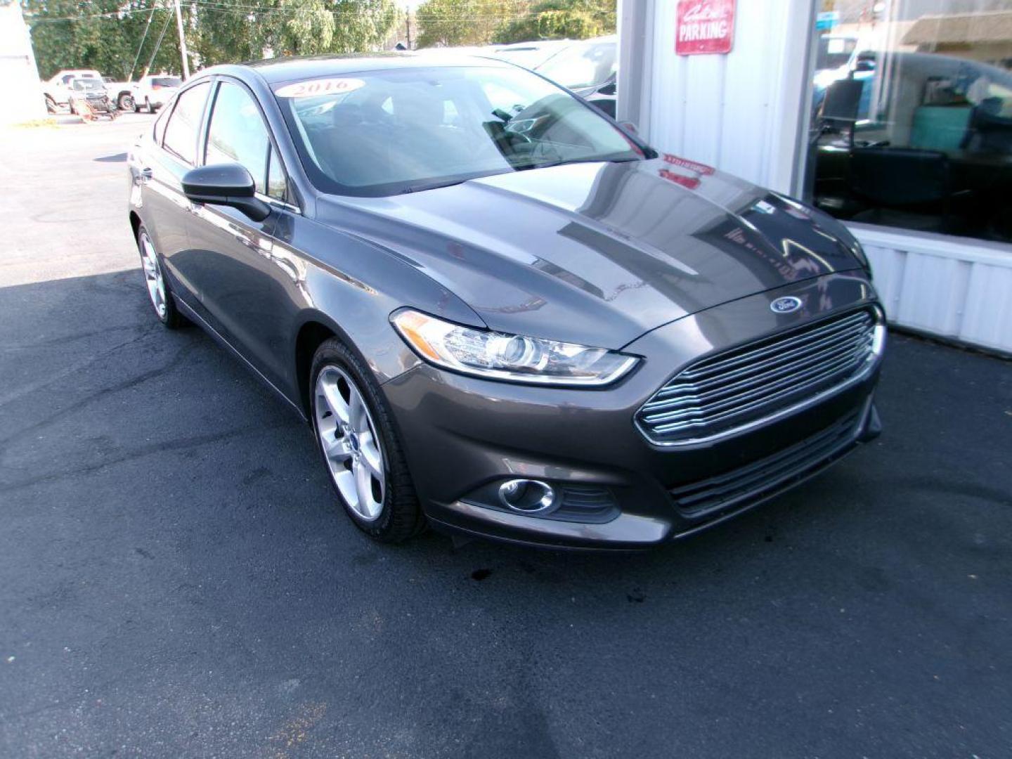 2016 GRAY FORD FUSION S (3FA6P0G75GR) with an 2.5L engine, Automatic transmission, located at 501 E. Columbia St., Springfield, OH, 45503, (800) 262-7122, 39.925262, -83.801796 - ***38 Service Records on CarFax *** Serviced and Detailed *** S w/ appearance package *** NICE *** FWD *** Back Up Camera *** Alloy Wheels *** Jay North Auto has offered hand picked vehicles since 1965! Our customer's enjoy a NO pressure buying experience with a small town feel. All of our vehi - Photo#2