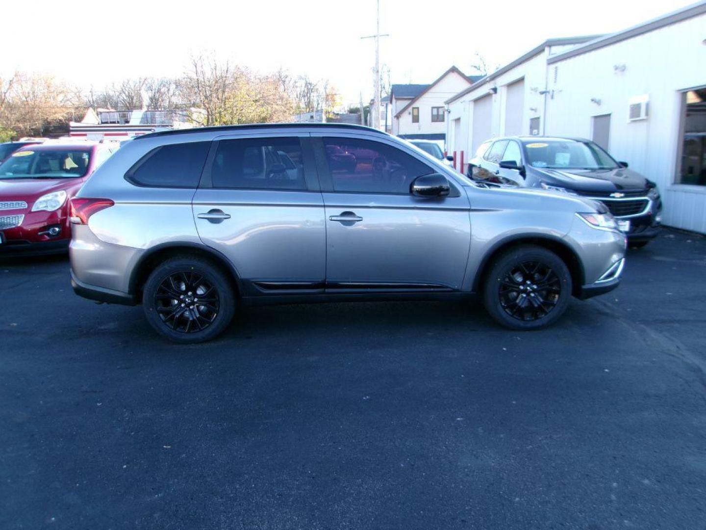 2018 GRAY MITSUBISHI OUTLANDER LE (JA4AD3A31JZ) with an 2.4L engine, Automatic transmission, located at 501 E. Columbia St., Springfield, OH, 45503, (800) 262-7122, 39.925262, -83.801796 - ***Outlander***Clean Carfax***LE***New Tires***New Front and Rear Pads and Rotors***Serviced and Detailed*** Limited Edition Features INCLUDED Power Glass Sunroof with Sunshade and Tilt Feature Blind Spot Warning (BSW) with Rear Cross Traffic Alert (RCTA) and Lane Change Assist (LCA) 18'' - Photo#0