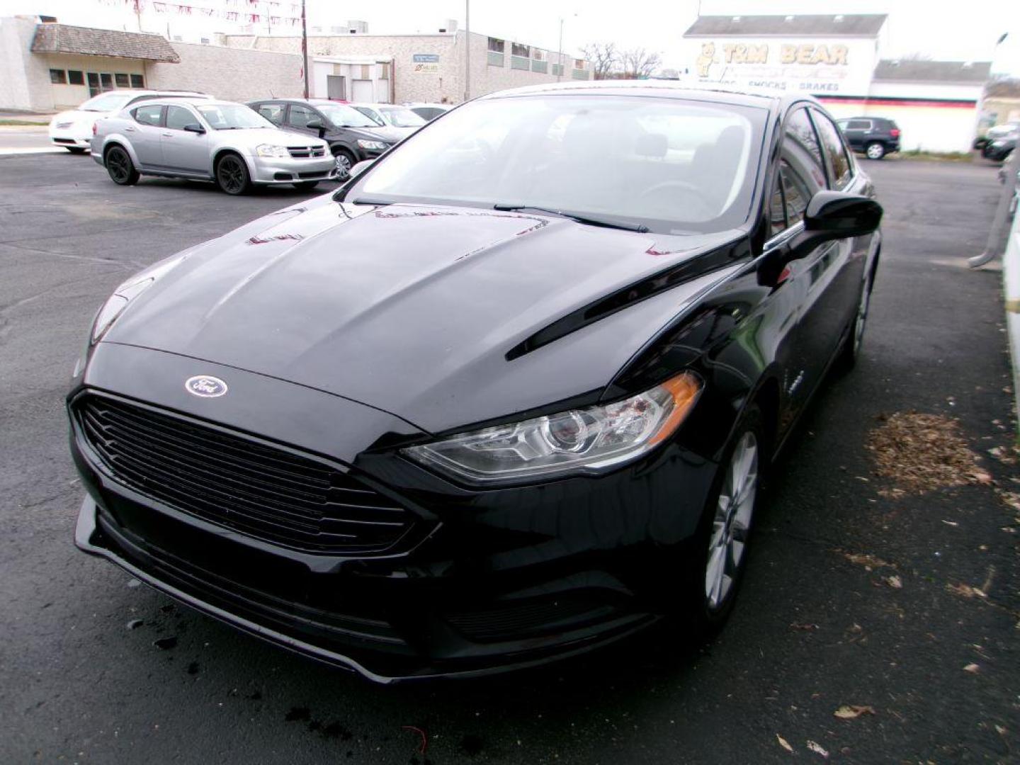 2017 BLACK FORD FUSION SE HYBRID (3FA6P0LU1HR) with an 2.0L engine, Continuously Variable transmission, located at 501 E. Columbia St., Springfield, OH, 45503, (800) 262-7122, 39.925262, -83.801796 - Photo#6