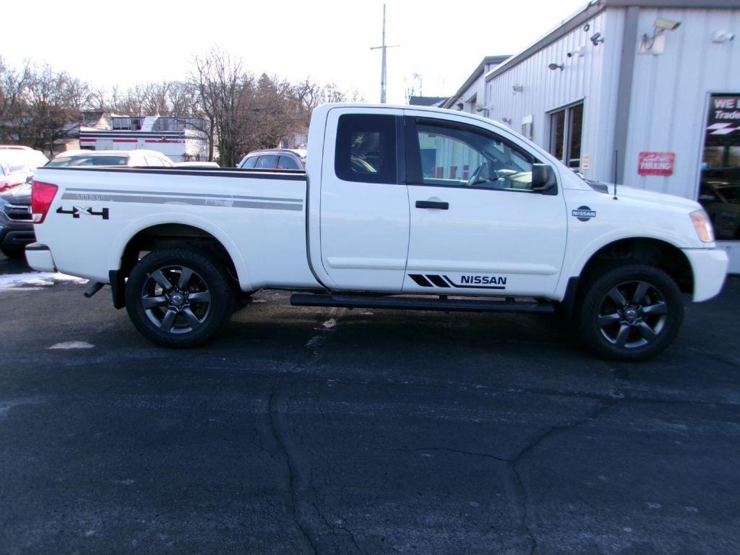 2012 WHITE NISSAN TITAN SV (1N6AA0CJ2CN) with an 5.6L engine, Automatic transmission, located at 501 E. Columbia St., Springfield, OH, 45503, (800) 262-7122, 39.925262, -83.801796 - ***SV***Clean Carfax***Like New Tires***New Front and Rear Pads and Rotors***4X4***Serviced and Detailed*** Jay North Auto has offered hand picked vehicles since 1965! Our customer's enjoy a NO pressure buying experience with a small town feel. All of our vehicles get fully inspected and detaile - Photo#0