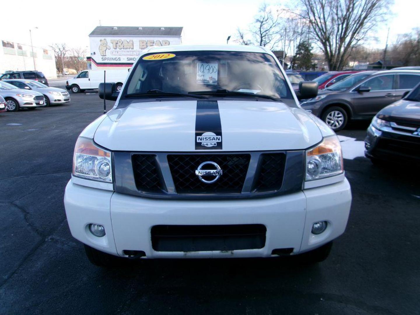 2012 WHITE NISSAN TITAN SV (1N6AA0CJ2CN) with an 5.6L engine, Automatic transmission, located at 501 E. Columbia St., Springfield, OH, 45503, (800) 262-7122, 39.925262, -83.801796 - ***SV***Clean Carfax***Like New Tires***New Front and Rear Pads and Rotors***4X4***Serviced and Detailed*** Jay North Auto has offered hand picked vehicles since 1965! Our customer's enjoy a NO pressure buying experience with a small town feel. All of our vehicles get fully inspected and detaile - Photo#1