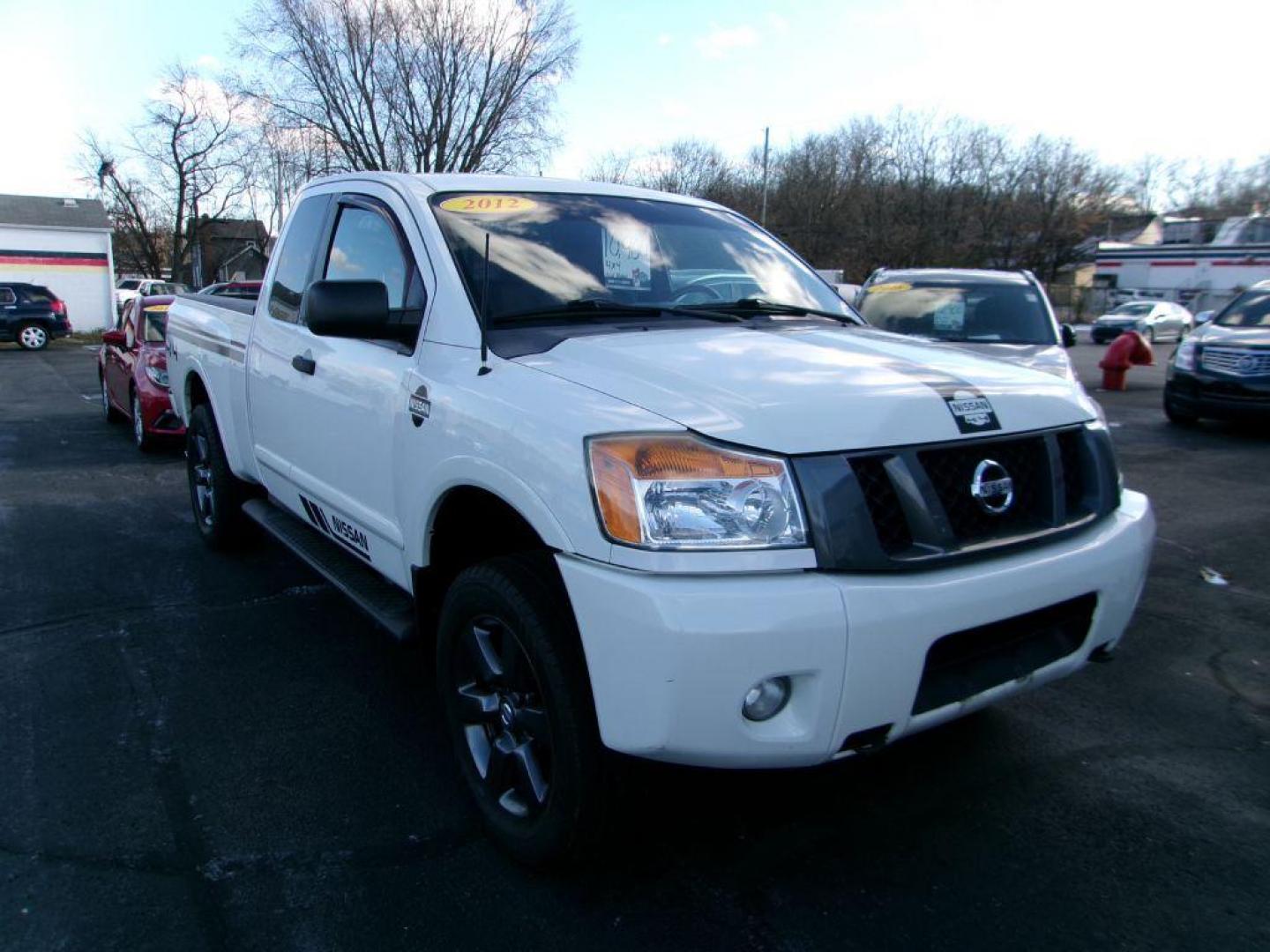 2012 WHITE NISSAN TITAN SV (1N6AA0CJ2CN) with an 5.6L engine, Automatic transmission, located at 501 E. Columbia St., Springfield, OH, 45503, (800) 262-7122, 39.925262, -83.801796 - ***SV***Clean Carfax***Like New Tires***New Front and Rear Pads and Rotors***4X4***Serviced and Detailed*** Jay North Auto has offered hand picked vehicles since 1965! Our customer's enjoy a NO pressure buying experience with a small town feel. All of our vehicles get fully inspected and detaile - Photo#2