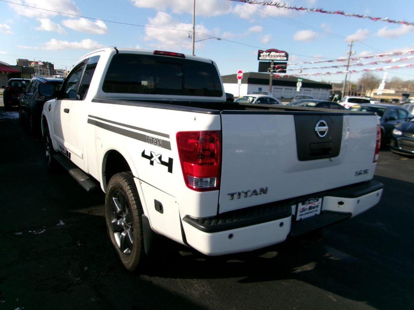 2012 WHITE NISSAN TITAN SV (1N6AA0CJ2CN) with an 5.6L engine, Automatic transmission, located at 501 E. Columbia St., Springfield, OH, 45503, (800) 262-7122, 39.925262, -83.801796 - ***SV***Clean Carfax***Like New Tires***New Front and Rear Pads and Rotors***4X4***Serviced and Detailed*** Jay North Auto has offered hand picked vehicles since 1965! Our customer's enjoy a NO pressure buying experience with a small town feel. All of our vehicles get fully inspected and detaile - Photo#5