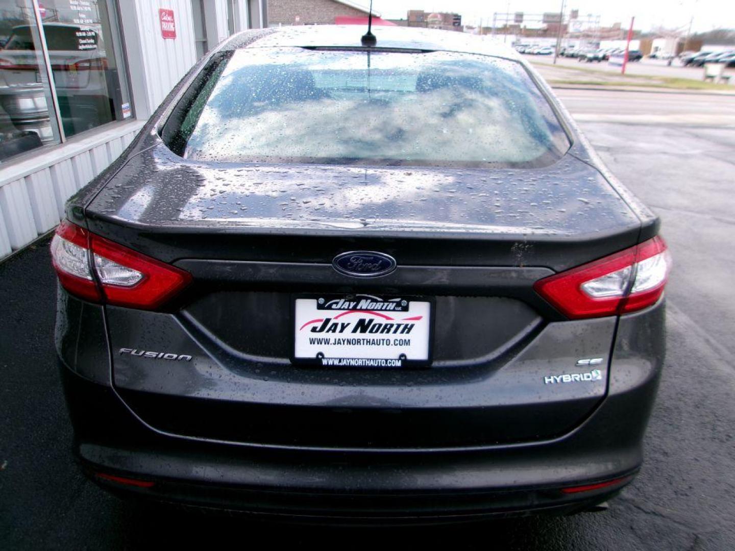 2016 GRAY FORD FUSION SE HYBRID (3FA6P0LU7GR) with an 2.0L engine, Continuously Variable transmission, located at 501 E. Columbia St., Springfield, OH, 45503, (800) 262-7122, 39.925262, -83.801796 - ***SE***Hybrid***Serviced and Detailed*** GREAT MPG *** Jay North Auto has offered hand picked vehicles since 1965! Our customer's enjoy a NO pressure buying experience with a small town feel. All of our vehicles get fully inspected and detailed. We are a preferred dealer for many local credit u - Photo#5