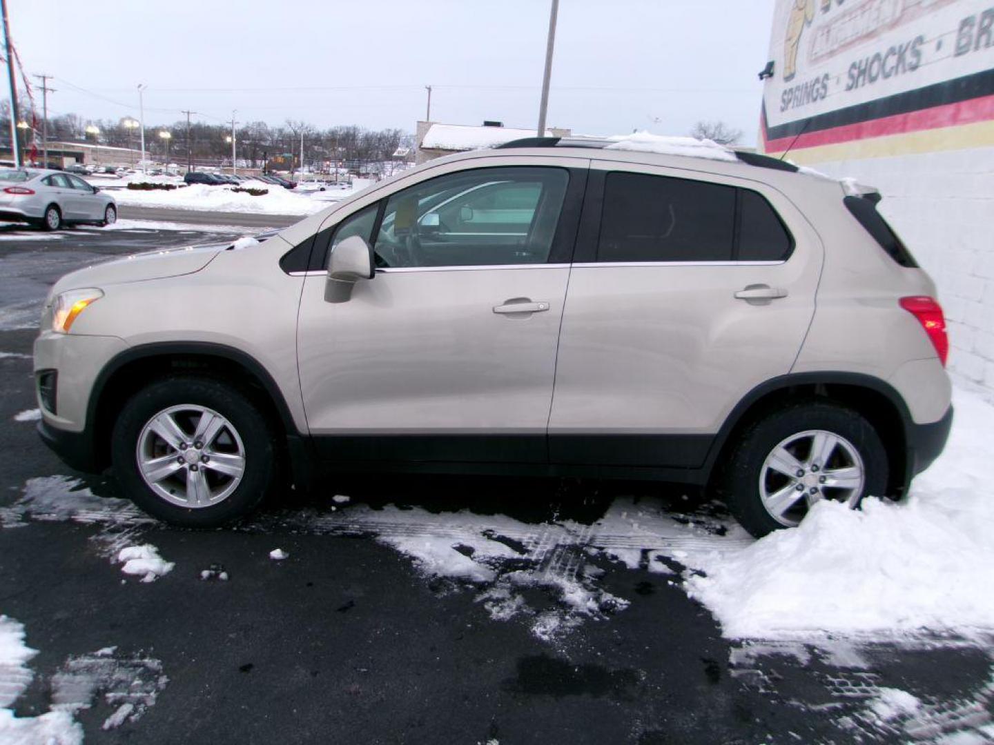 2016 GOLD CHEVROLET TRAX 1LT (3GNCJPSB8GL) with an 1.4L engine, Automatic transmission, located at 501 E. Columbia St., Springfield, OH, 45503, (800) 262-7122, 39.925262, -83.801796 - *** New Tires *** Back Up Camera *** Serviced and Detailed *** LT *** All Wheel Drive *** Jay North Auto has offered hand picked vehicles since 1965! Our customer's enjoy a NO pressure buying experience with a small town feel. All of our vehicles get fully inspected and detailed. We are a prefe - Photo#0