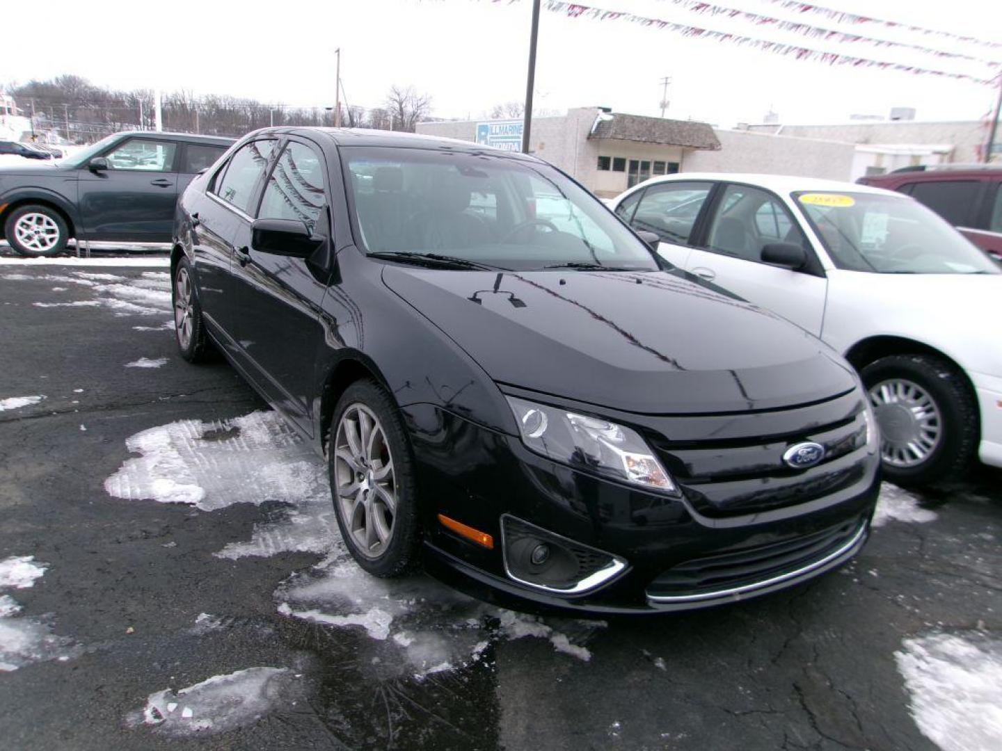 2012 BLACK FORD FUSION SEL (3FAHP0JA4CR) with an 2.5L engine, Automatic transmission, located at 501 E. Columbia St., Springfield, OH, 45503, (800) 262-7122, 39.925262, -83.801796 - *** SEL *** FWD *** Serviced and Detailed *** Sony Audio *** Moonroof *** Leather *** Jay North Auto has offered hand picked vehicles since 1965! Our customer's enjoy a NO pressure buying experience with a small town feel. All of our vehicles get fully inspected and detailed. We are a preferred - Photo#2