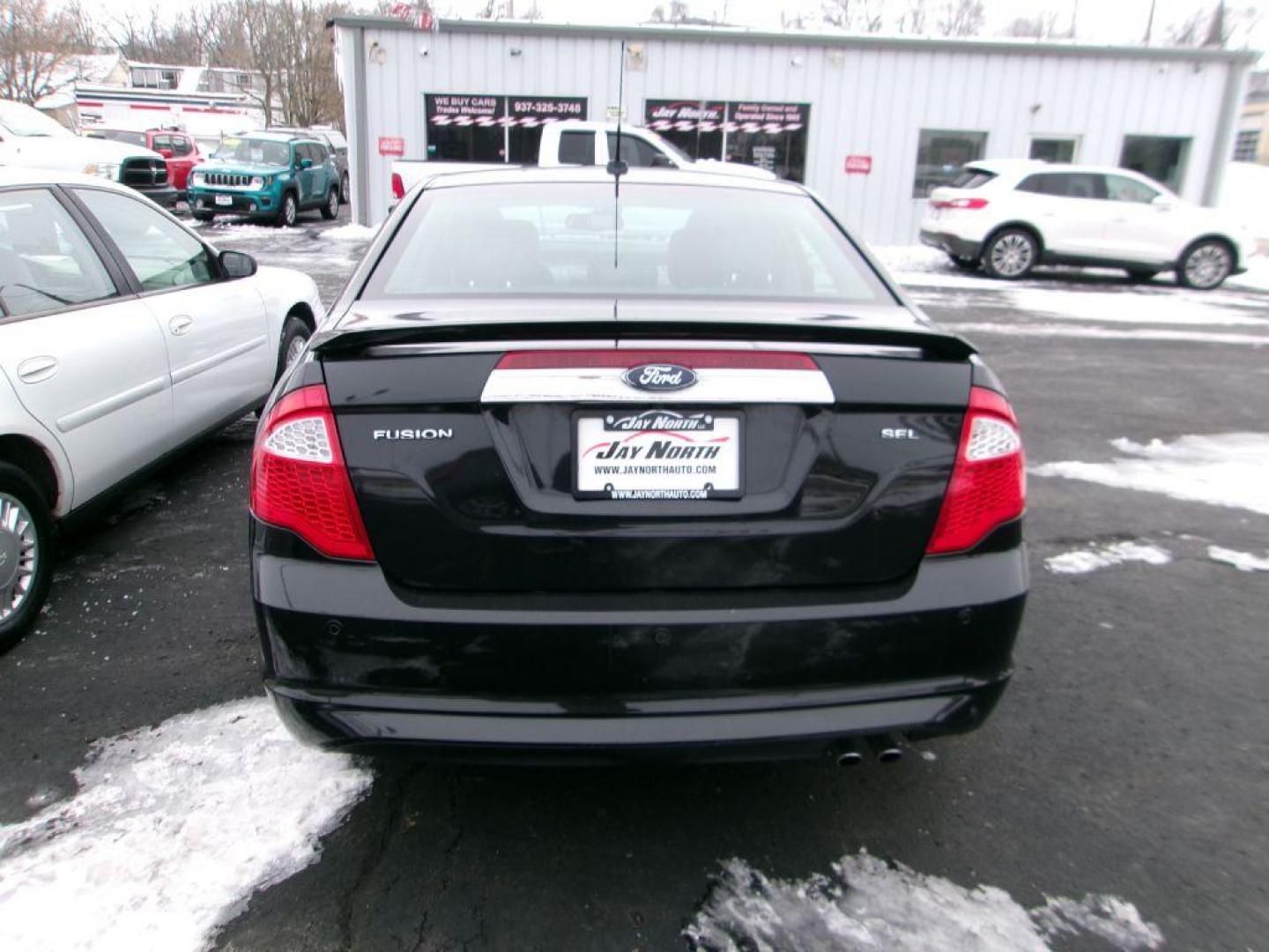 2012 BLACK FORD FUSION SEL (3FAHP0JA4CR) with an 2.5L engine, Automatic transmission, located at 501 E. Columbia St., Springfield, OH, 45503, (800) 262-7122, 39.925262, -83.801796 - *** SEL *** FWD *** Serviced and Detailed *** Sony Audio *** Moonroof *** Leather *** Jay North Auto has offered hand picked vehicles since 1965! Our customer's enjoy a NO pressure buying experience with a small town feel. All of our vehicles get fully inspected and detailed. We are a preferred - Photo#4