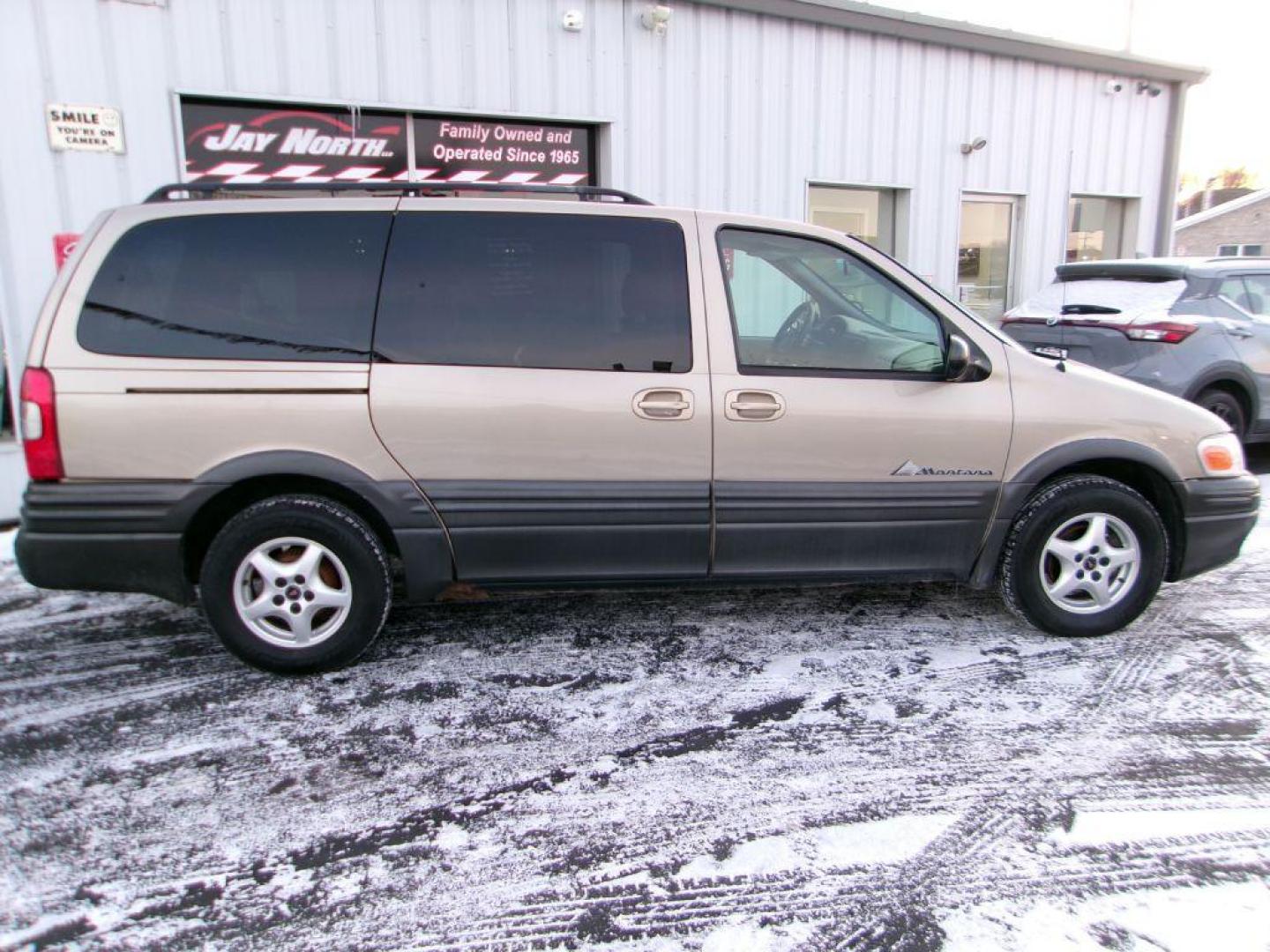 2005 TAN PONTIAC MONTANA (1GMDV23E55D) with an 3.4L engine, Automatic transmission, located at 501 E. Columbia St., Springfield, OH, 45503, (800) 262-7122, 39.925262, -83.801796 - *** Local Trade *** Serviced and Detailed *** 3.4L V6 *** NICE!!! *** Dual Sliding Doors *** Fold Down Seating *** Newer Tires *** Jay North Auto has offered hand picked vehicles since 1965! Our customer's enjoy a NO pressure buying experience with a small town feel. All of our vehicles get fu - Photo#0