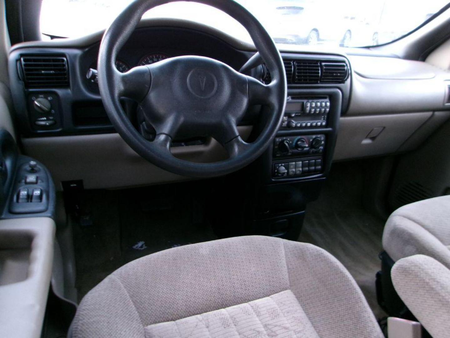 2005 TAN PONTIAC MONTANA (1GMDV23E55D) with an 3.4L engine, Automatic transmission, located at 501 E. Columbia St., Springfield, OH, 45503, (800) 262-7122, 39.925262, -83.801796 - *** Local Trade *** Serviced and Detailed *** 3.4L V6 *** NICE!!! *** Dual Sliding Doors *** Fold Down Seating *** Newer Tires *** Jay North Auto has offered hand picked vehicles since 1965! Our customer's enjoy a NO pressure buying experience with a small town feel. All of our vehicles get fu - Photo#9