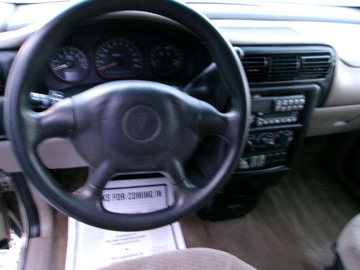 2005 TAN PONTIAC MONTANA (1GMDV23E55D) with an 3.4L engine, Automatic transmission, located at 501 E. Columbia St., Springfield, OH, 45503, (800) 262-7122, 39.925262, -83.801796 - *** Local Trade *** Serviced and Detailed *** 3.4L V6 *** NICE!!! *** Dual Sliding Doors *** Fold Down Seating *** Newer Tires *** Jay North Auto has offered hand picked vehicles since 1965! Our customer's enjoy a NO pressure buying experience with a small town feel. All of our vehicles get fu - Photo#12