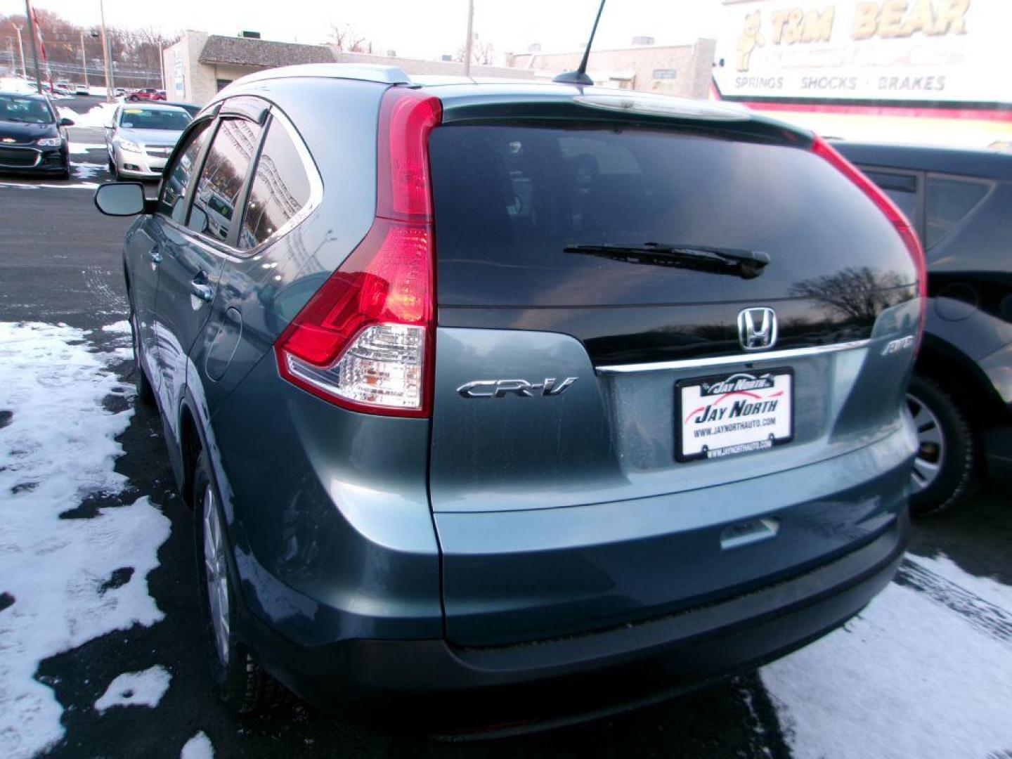 2014 BLUE HONDA CR-V EXL (2HKRM4H77EH) with an 2.4L engine, Automatic transmission, located at 501 E. Columbia St., Springfield, OH, 45503, (800) 262-7122, 39.925262, -83.801796 - *** Updated Timing w/ Honda Parts *** New Tires *** Serviced and Detailed *** New TIres *** Moonroof *** Heated Leather Seating *** NICE *** EXL AWD *** Jay North Auto has offered hand picked vehicles since 1965! Our customer's enjoy a NO pressure buying experience with a small town feel. All of - Photo#2