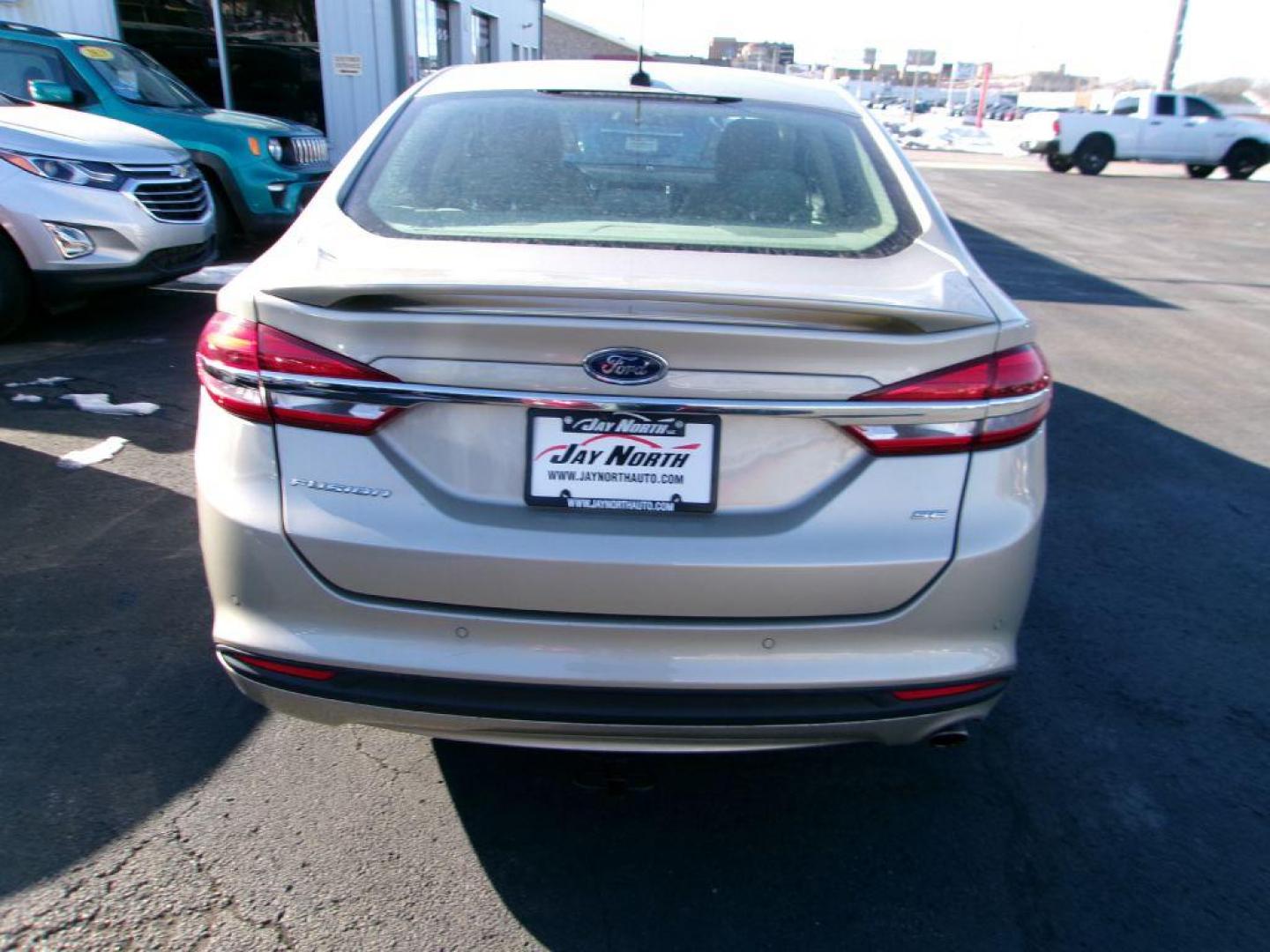 2017 GOLD FORD FUSION SE (3FA6P0H72HR) with an 2.5L engine, Automatic transmission, located at 501 E. Columbia St., Springfield, OH, 45503, (800) 262-7122, 39.925262, -83.801796 - *** Serviced and Detailed *** FWD *** SE *** Back Up Camera *** Jay North Auto has offered hand picked vehicles since 1965! Our customer's enjoy a NO pressure buying experience with a small town feel. All of our vehicles get fully inspected and detailed. We are a preferred dealer for many local - Photo#5