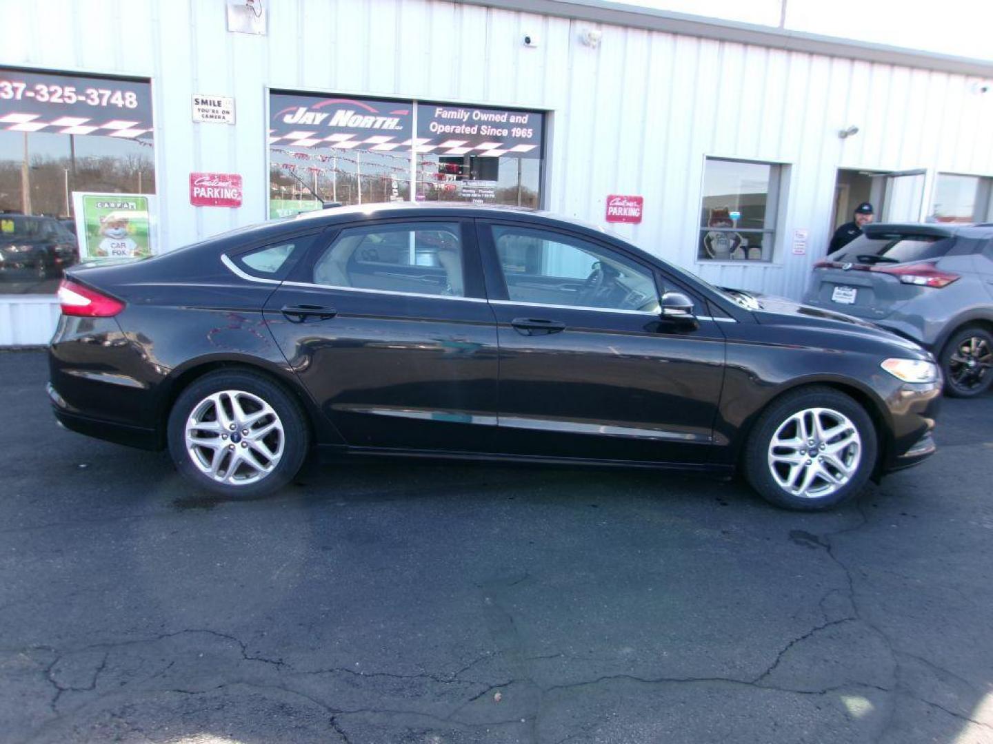 2013 BLACK FORD FUSION SE (3FA6P0H77DR) with an 2.5L engine, Automatic transmission, located at 501 E. Columbia St., Springfield, OH, 45503, (800) 262-7122, 39.925262, -83.801796 - *** New Tires *** SE *** Serviced and Detailed *** 24 Service Records on CarFax *** Jay North Auto has offered hand picked vehicles since 1965! Our customer's enjoy a NO pressure buying experience with a small town feel. All of our vehicles get fully inspected and detailed. We are a preferred d - Photo#0