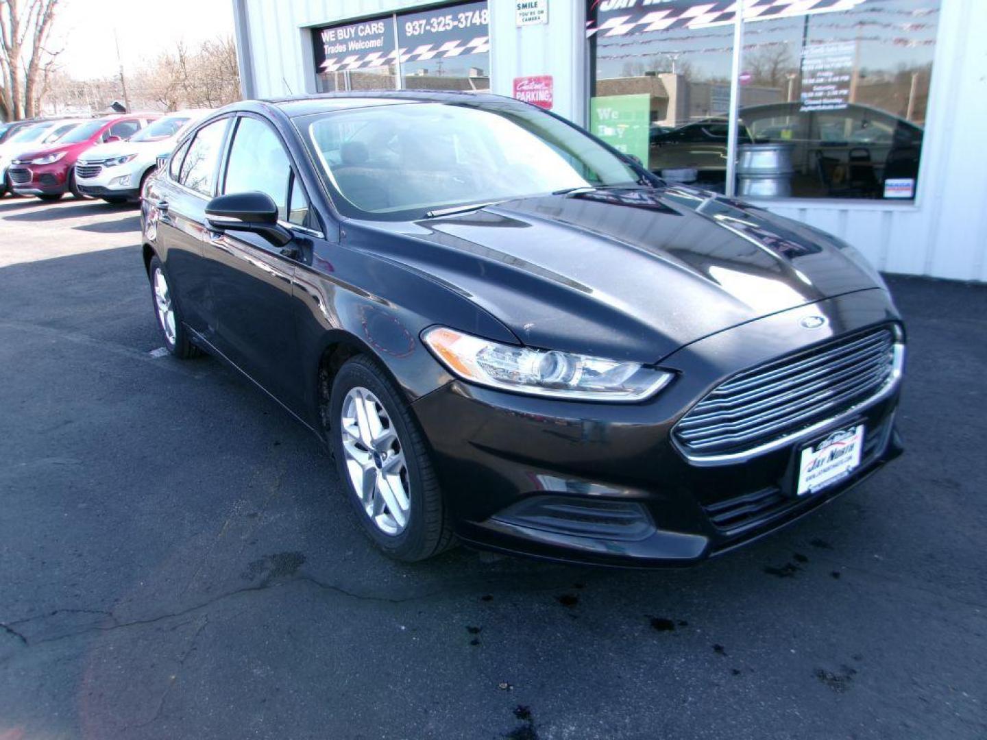 2013 BLACK FORD FUSION SE (3FA6P0H77DR) with an 2.5L engine, Automatic transmission, located at 501 E. Columbia St., Springfield, OH, 45503, (800) 262-7122, 39.925262, -83.801796 - *** New Tires *** SE *** Serviced and Detailed *** 24 Service Records on CarFax *** Jay North Auto has offered hand picked vehicles since 1965! Our customer's enjoy a NO pressure buying experience with a small town feel. All of our vehicles get fully inspected and detailed. We are a preferred d - Photo#1