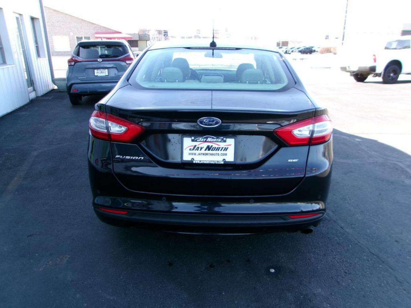 2013 BLACK FORD FUSION SE (3FA6P0H77DR) with an 2.5L engine, Automatic transmission, located at 501 E. Columbia St., Springfield, OH, 45503, (800) 262-7122, 39.925262, -83.801796 - *** New Tires *** SE *** Serviced and Detailed *** 24 Service Records on CarFax *** Jay North Auto has offered hand picked vehicles since 1965! Our customer's enjoy a NO pressure buying experience with a small town feel. All of our vehicles get fully inspected and detailed. We are a preferred d - Photo#4